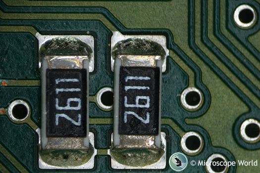 Circuit board under microscope with partial polarized light.