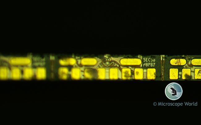 Metallurgical microscope image showing resolution and magnification.